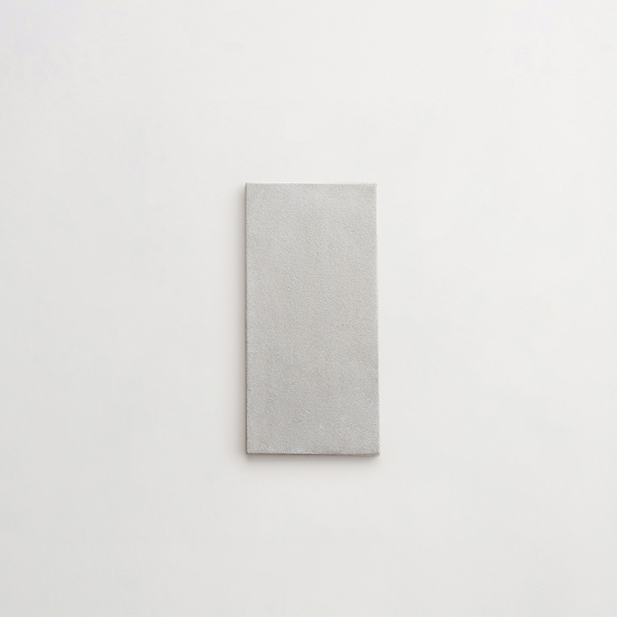 Ceramic Shibori Tile White 8x4 Grey Stain tile.