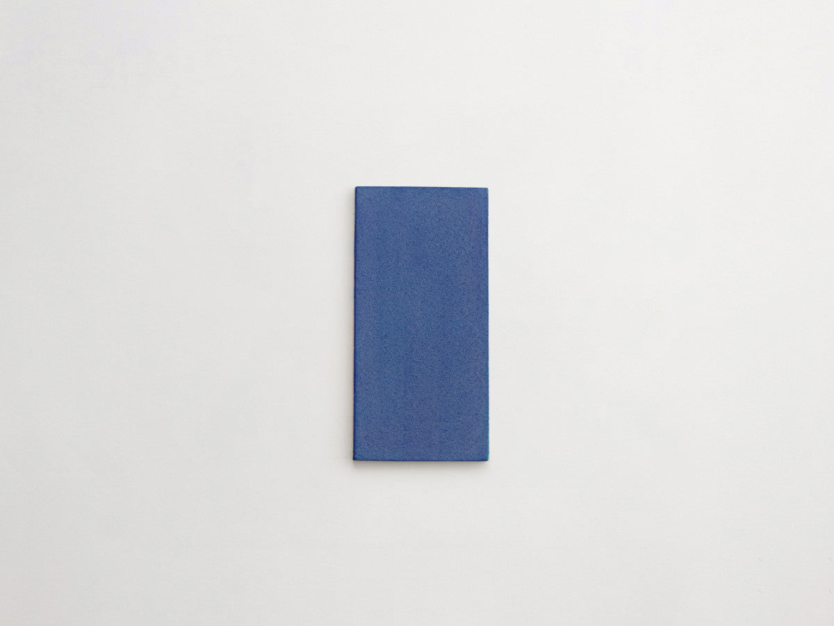 Ceramic Shibori Tile Natural 8x4 Indigo Stain tile.