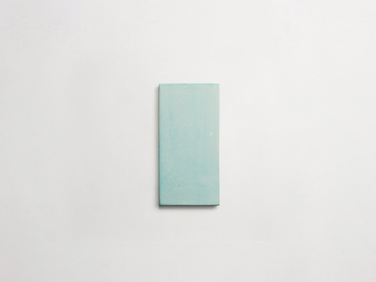 Ceramic Shibori Tile White 8x4 Teal Wash tile.