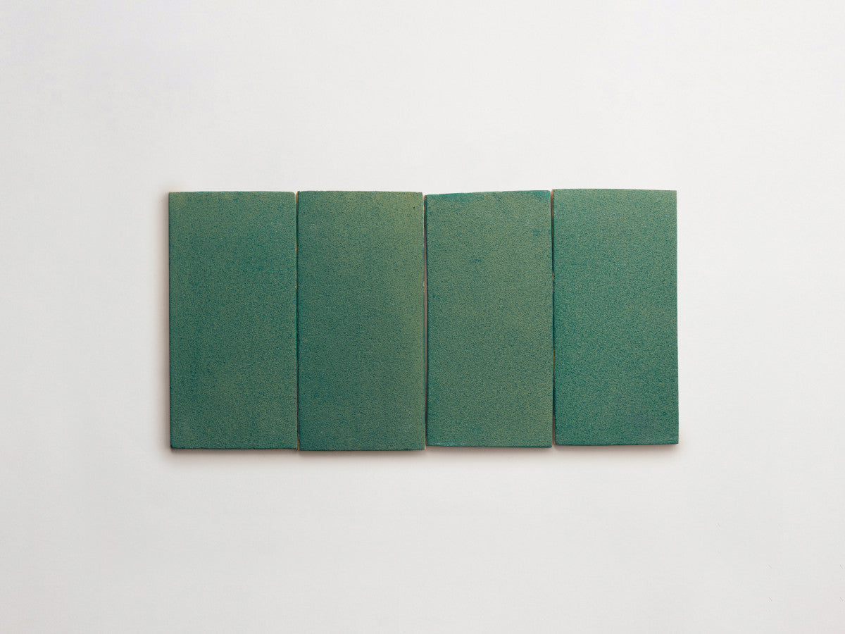 Ceramic Shibori Tile Natural 8x4 Teal Stain tile.