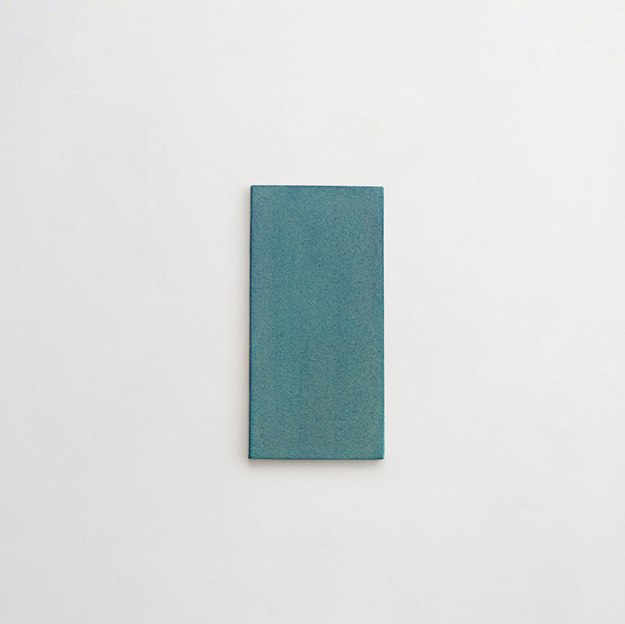 Ceramic Shibori Tile Natural 8x4 Teal Stain tile.