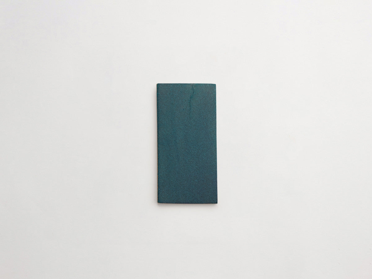 Ceramic Shibori Tile Grey 8x4 Teal Stain tile.