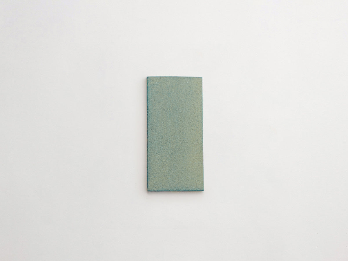 Ceramic Shibori Tile Natural 8x4 Teal Wash tile.