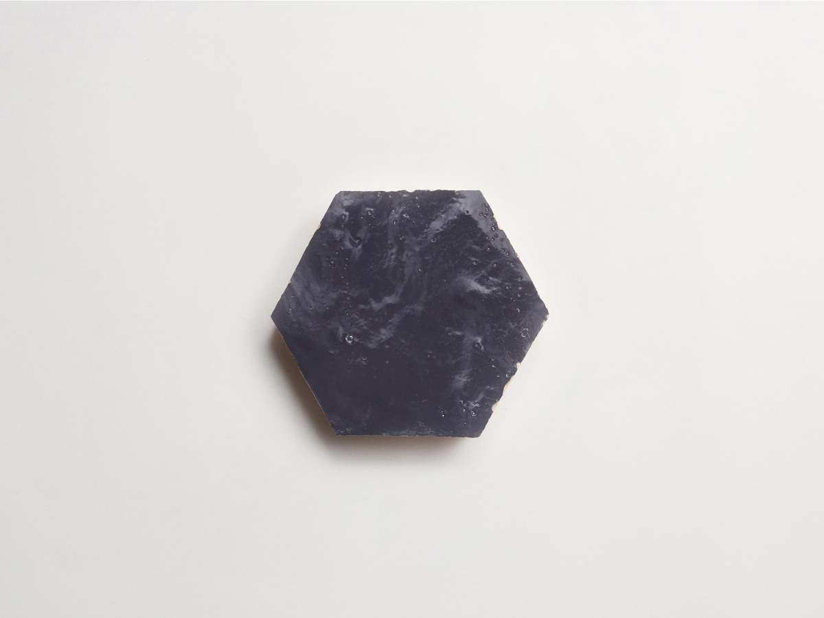 Zellige tile battled armor dark grey hexagon.