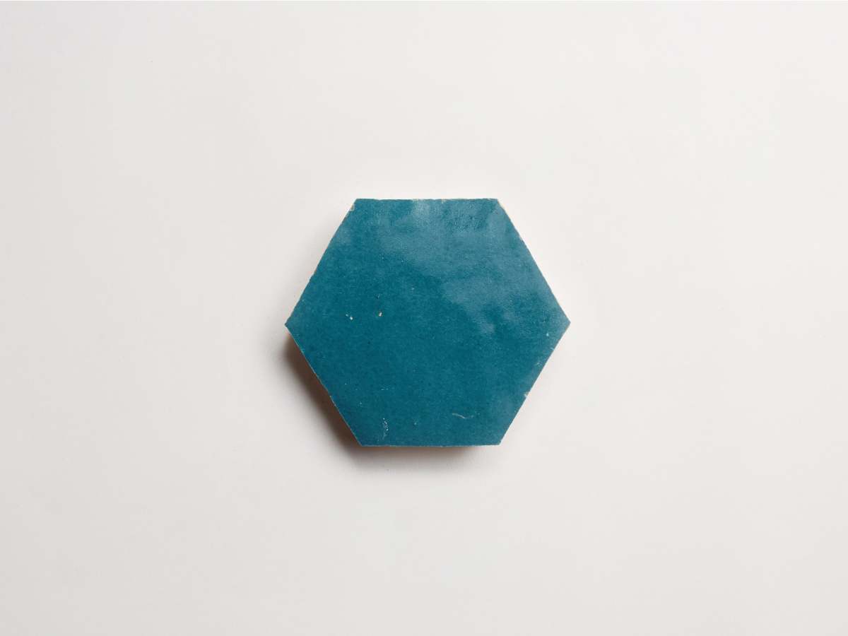 Zellige tile dark teal fired opal hexagon.