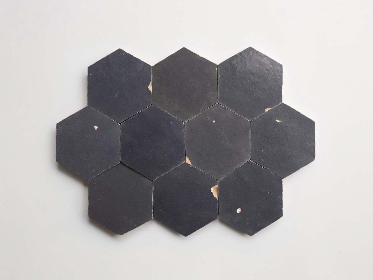 Zellige tile battled armor dark grey hexagon.