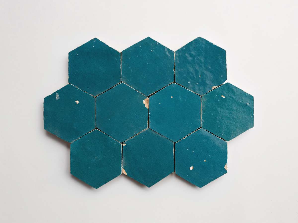 Zellige tile dark teal fired opal hexagon.