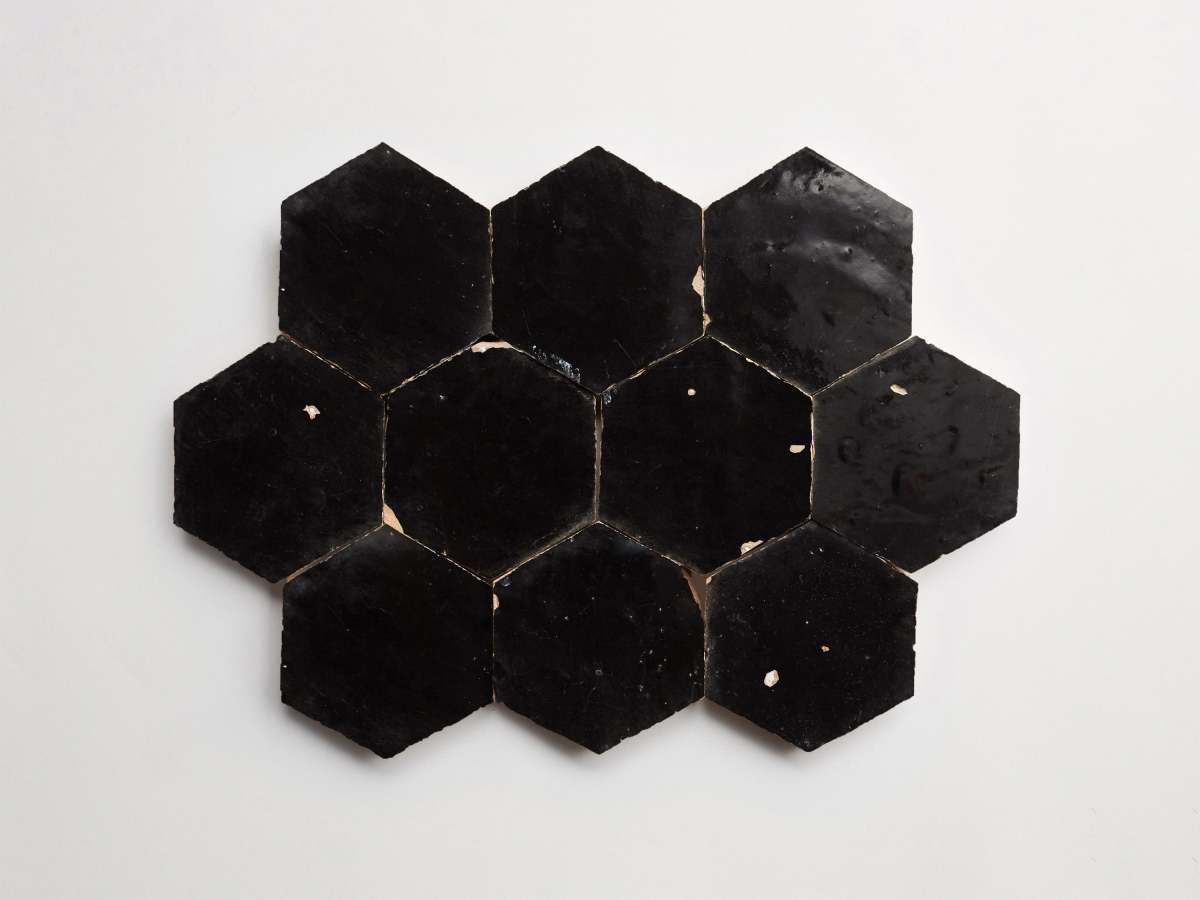 Dark zellige tile scribe's ink black hexagon.