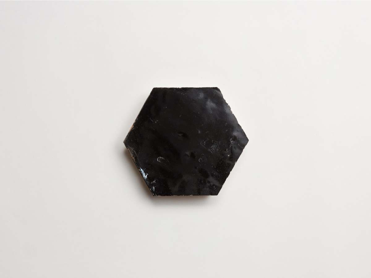 Dark zellige tile scribe's ink black hexagon.
