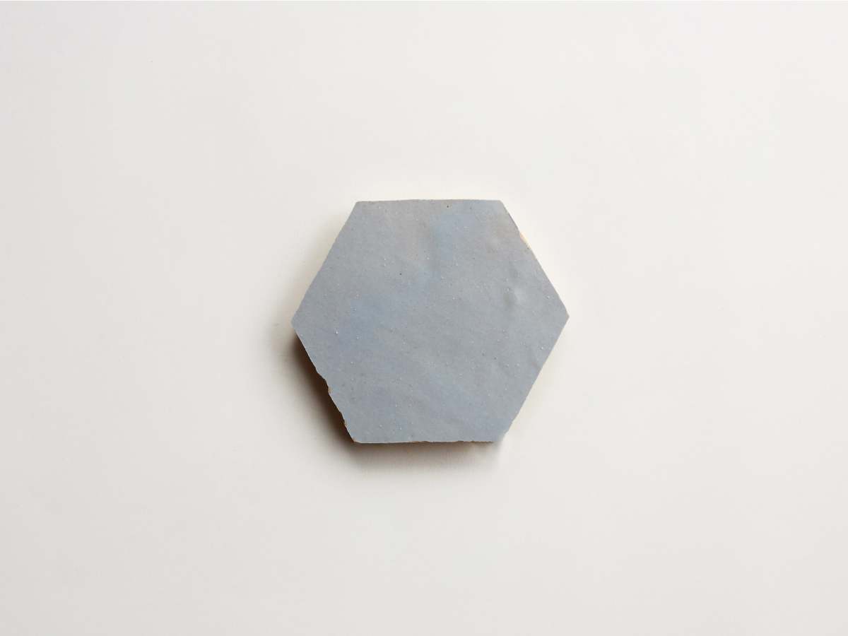 Light blue zellige tile shattered pearl hexagon.