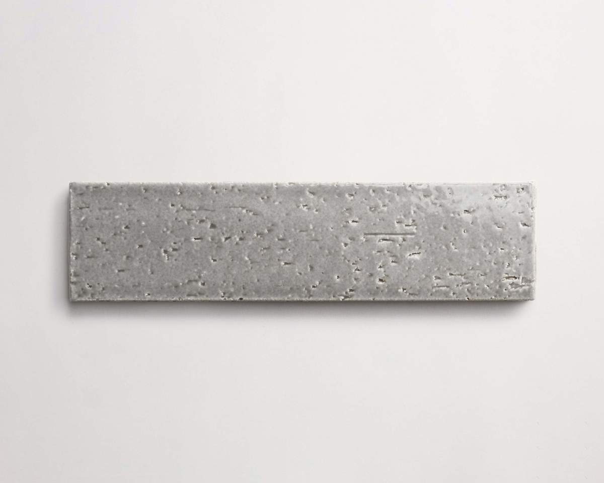Modern farmhouse glazed brick subway gloss grey tile.