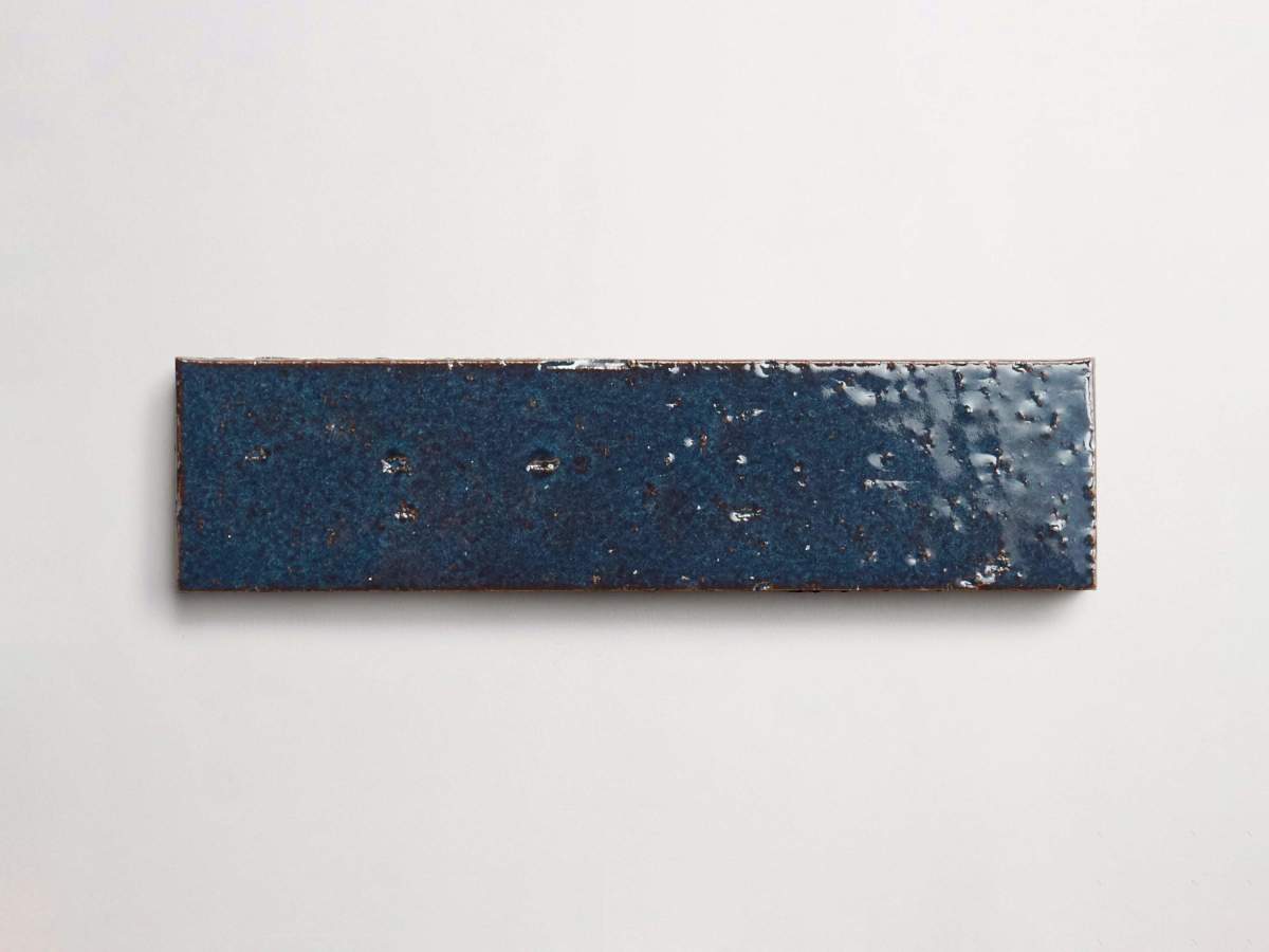 Modern farmhouse glazed brick brindled blue gloss tile.