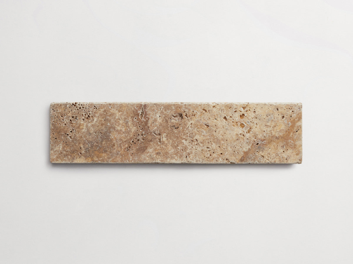 Pantry pavers tumbled travertine 3x12 pumice tile.