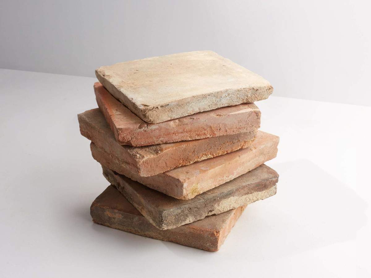 Antique terracotta provincial red square tile.