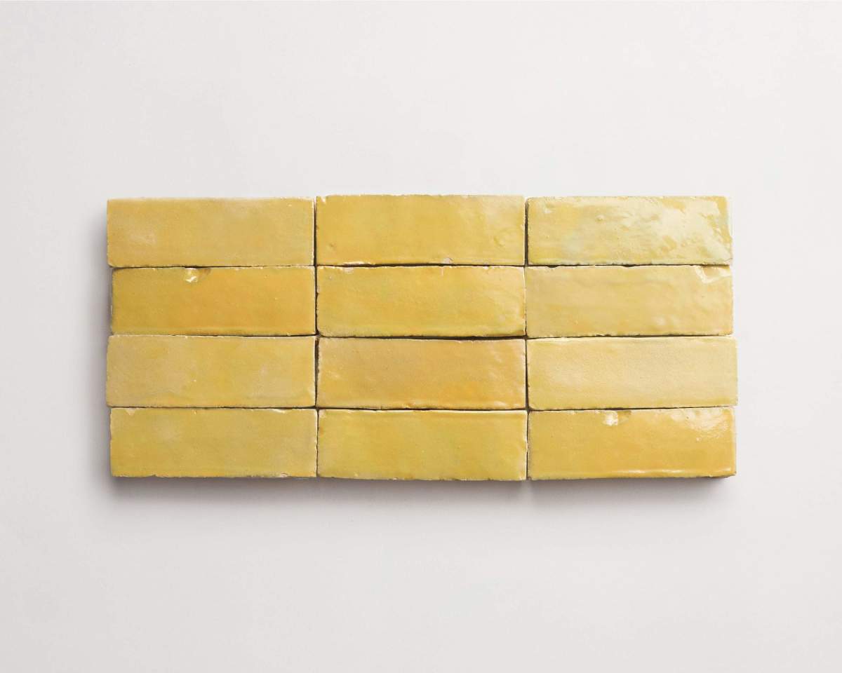 Twelve rectangular yellow bars are arranged in three rows of four on a plain white background.