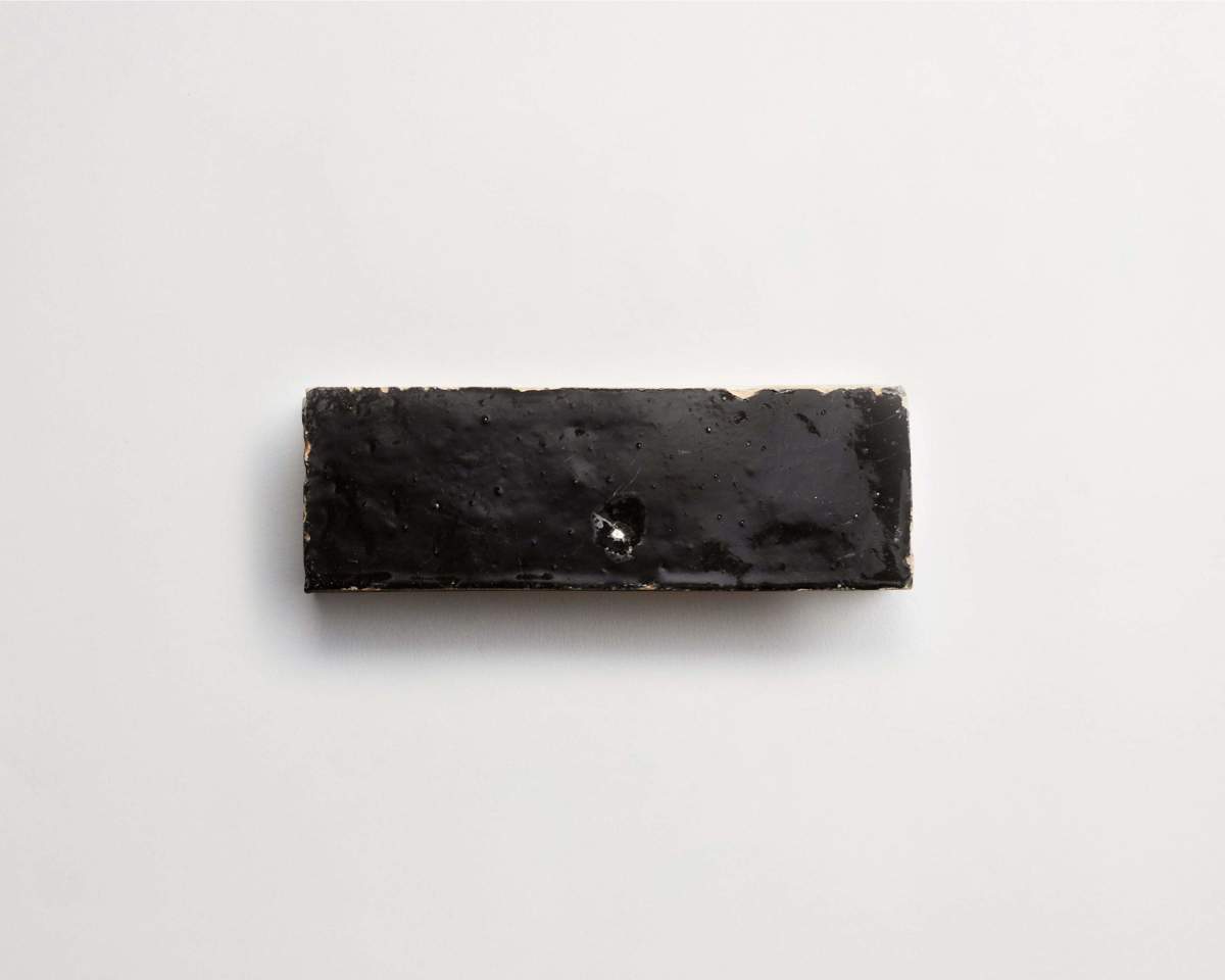 A rectangular, dark brown or black energy bar on a plain white background.