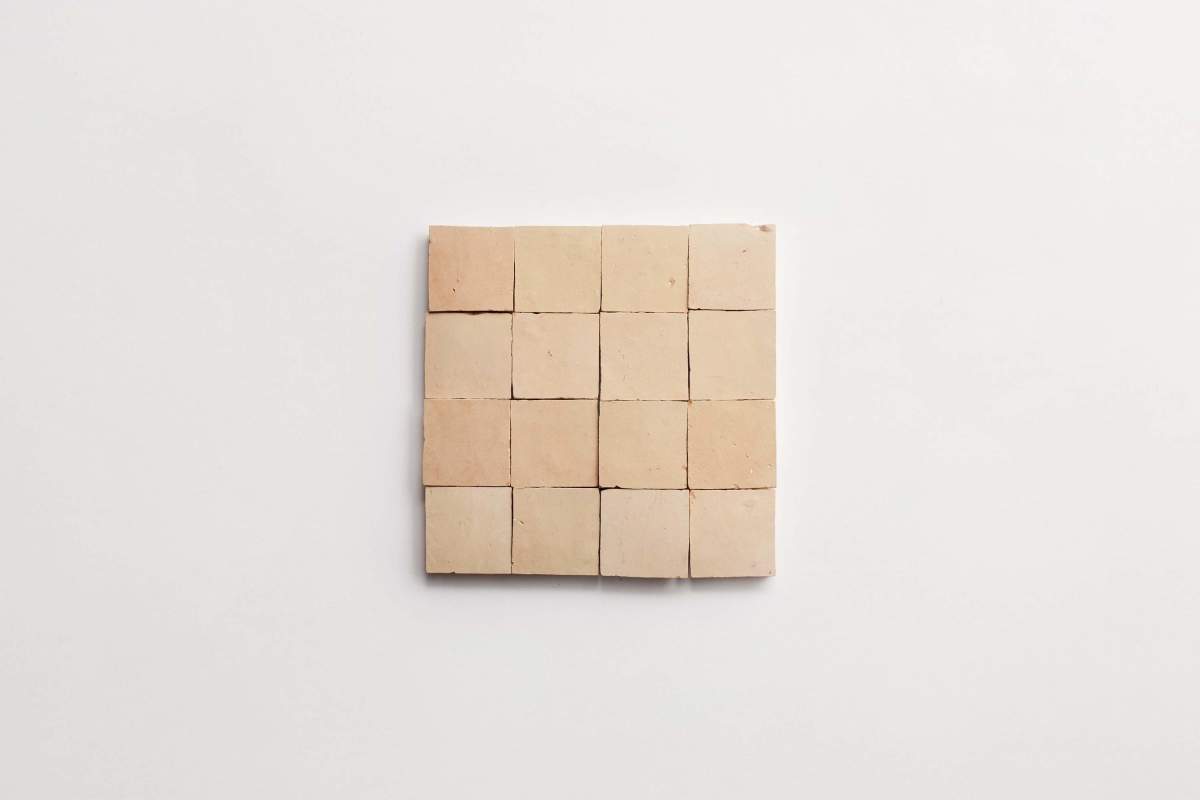 A square block divided into sixteen smaller, even beige cubes arranged in a 4x4 grid on a plain white background.