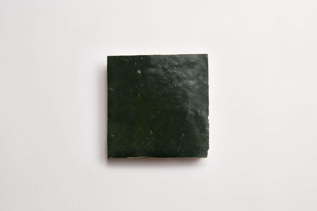A single square sheet of dried seaweed nori on a plain white background.