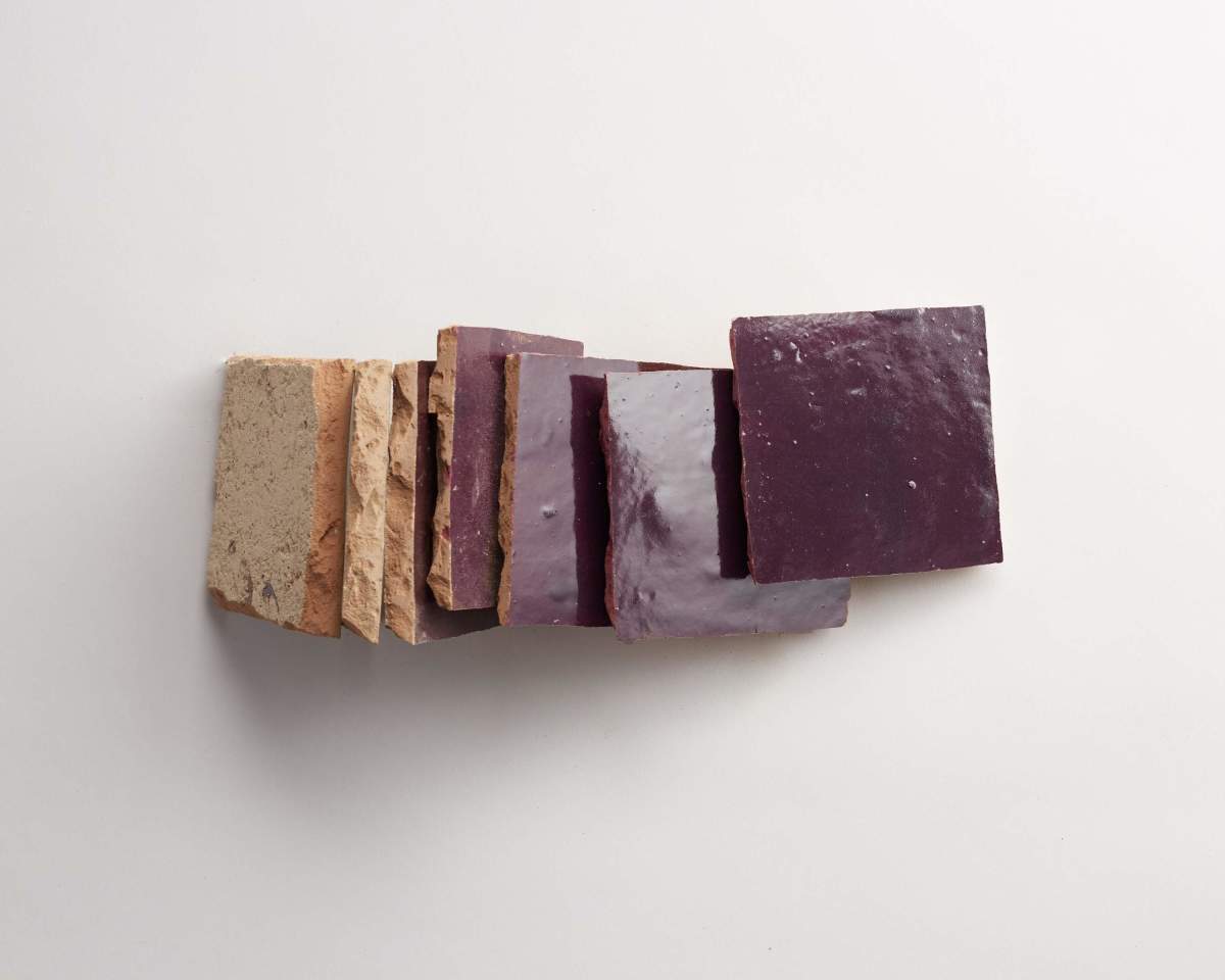 Seven rectangular pieces of material, alternating between beige and purple, are arranged in a row on a white background.