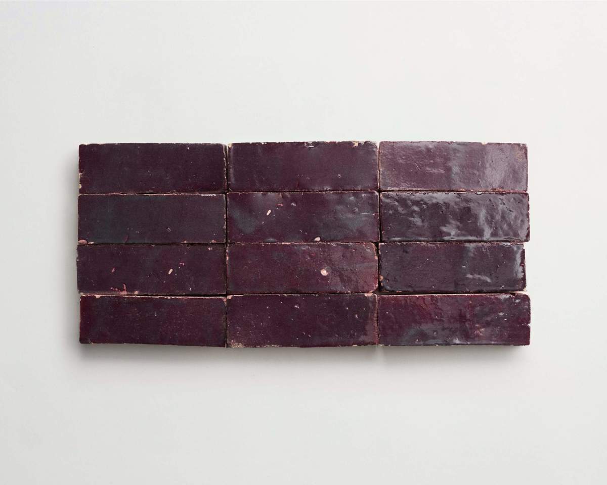 Twelve rectangular dark purple tiles are arranged in three horizontal rows against a plain white background.