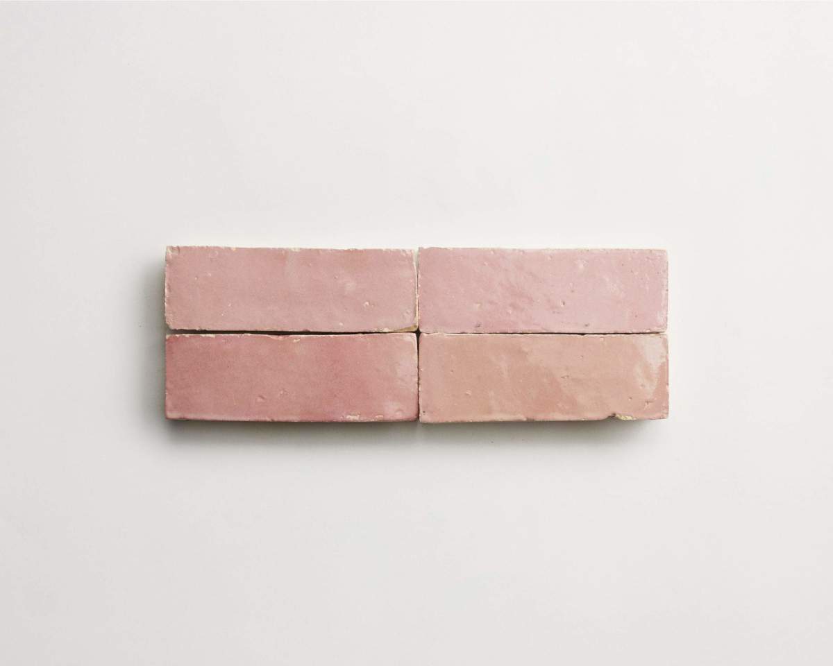 Four rectangular, glossy pink tiles arranged in two rows on a plain white background.