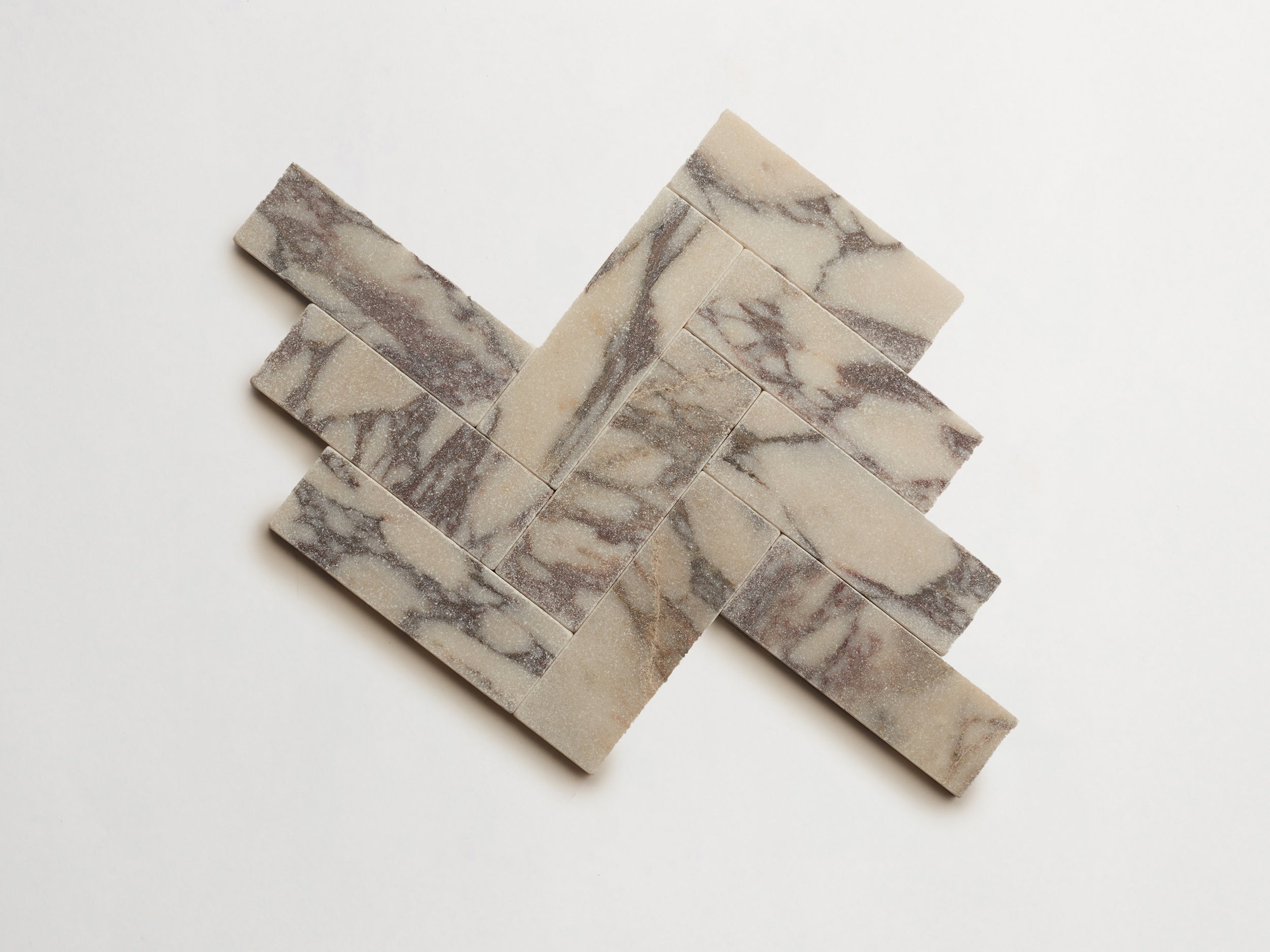 cle-tile-stone-tumbled-lapidary-calacatta-viola-baguette-herringbone-3000x3000-300dpi.jpg