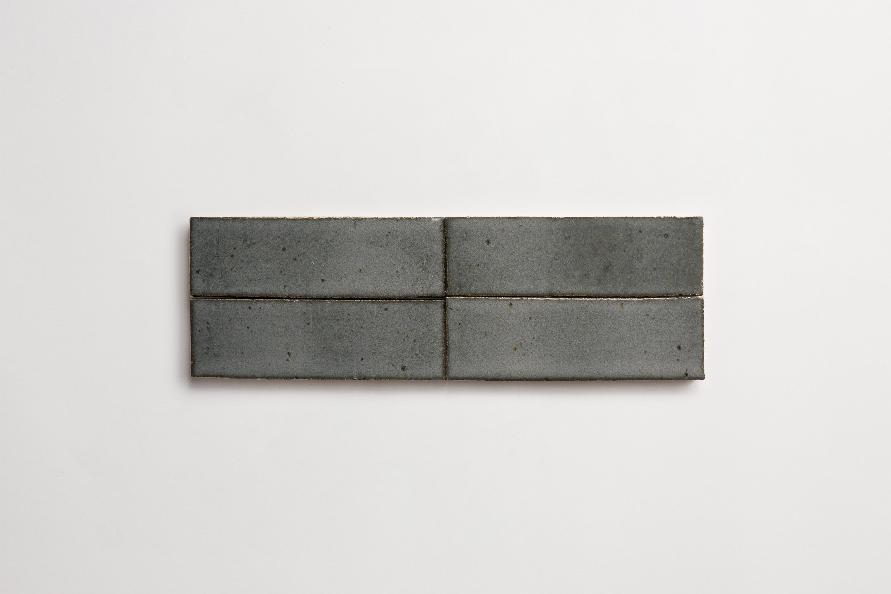 clé guild | thin glazed brick | black wool | 8 x 2.5 x 0.5