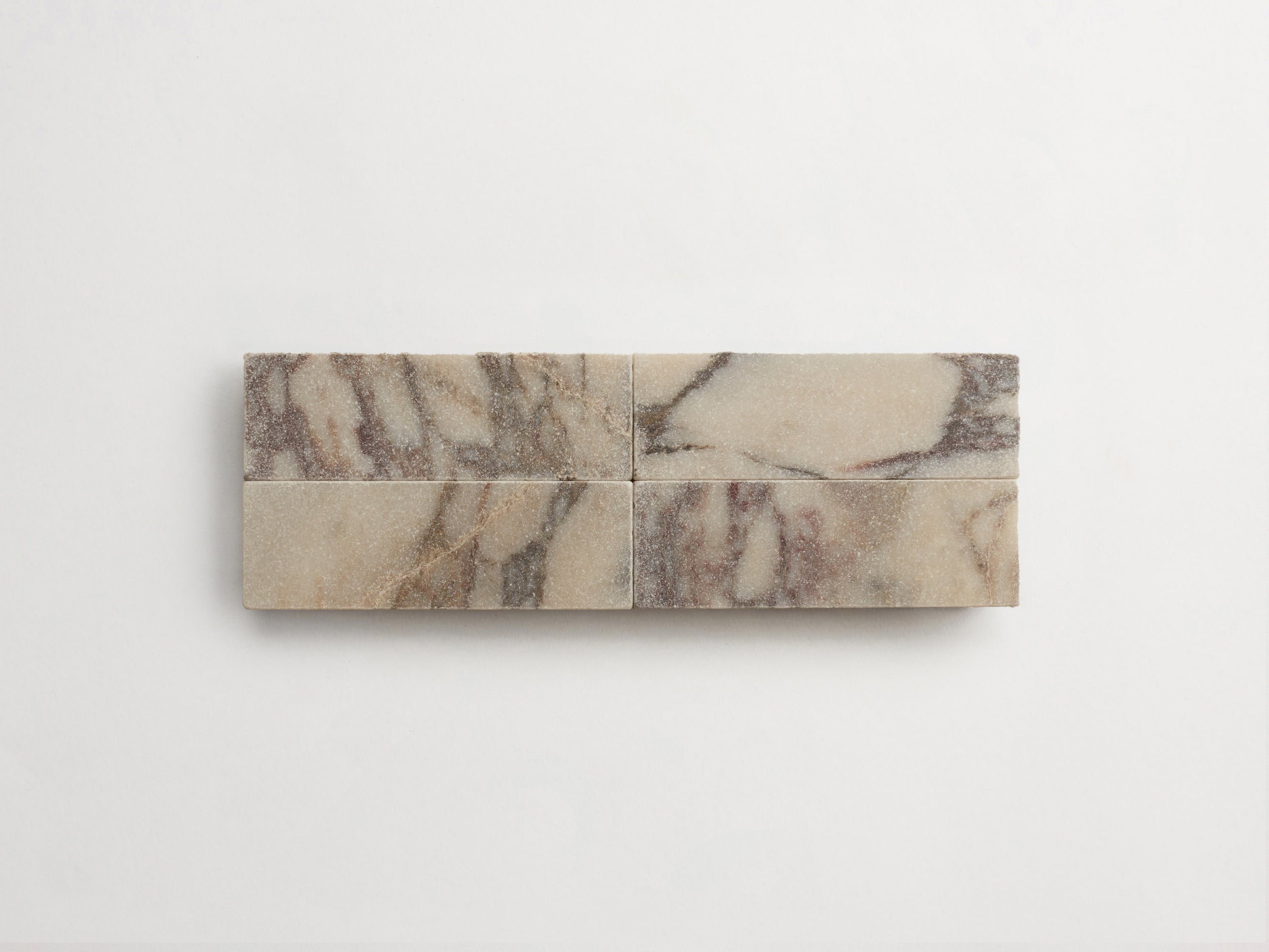 cle-tile-stone-tumbled-lapidary-baguette-4up-calacatta-viola-3000x2250-300dpi.jpg