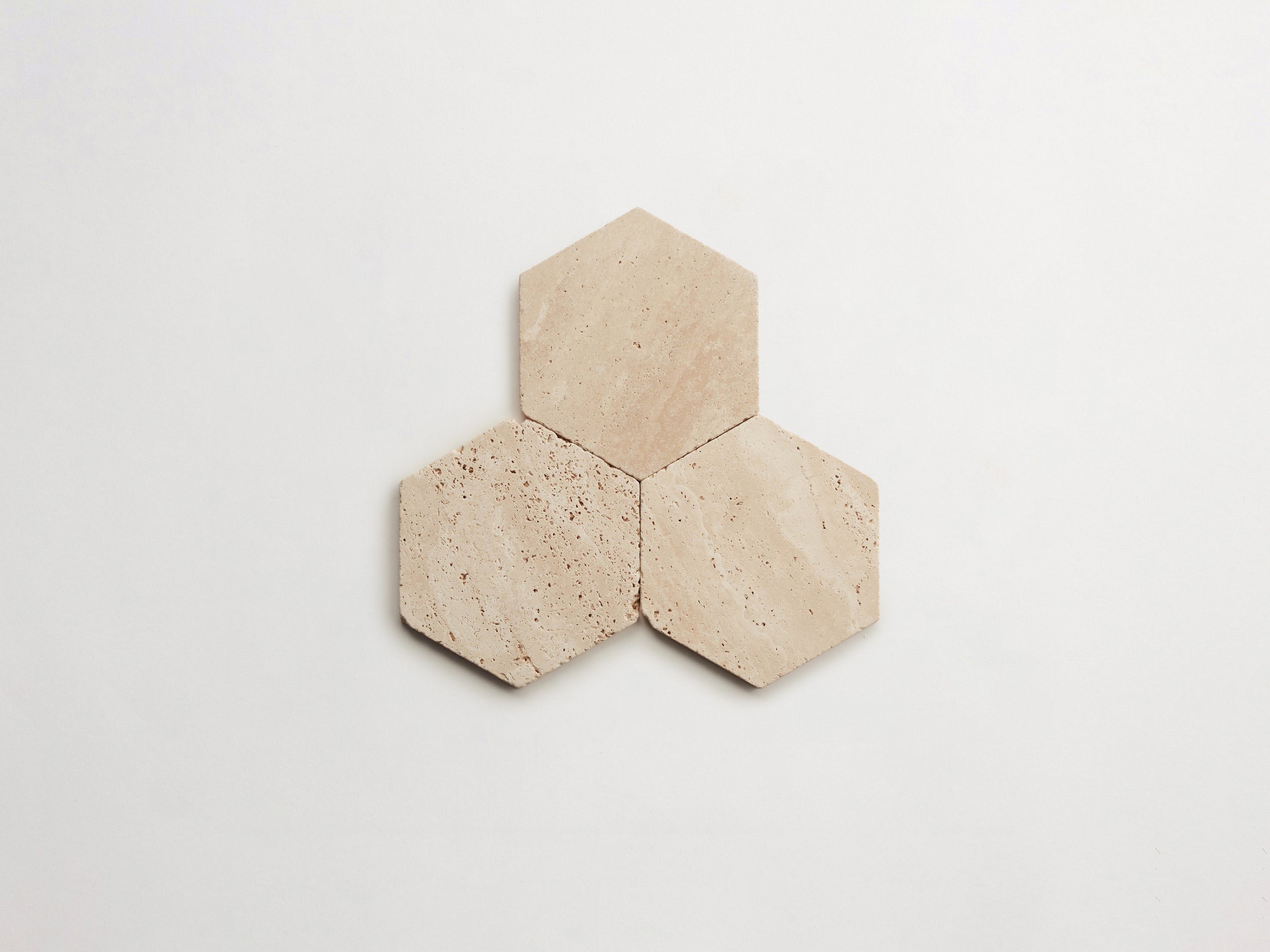cle-tile-stone-tumbled-lapidary-beige-travertine-hex-3up-3000x2250-300dpi .jpg
