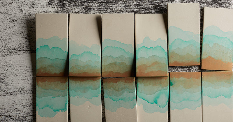 Hand painted tiles that resemble sky and sea